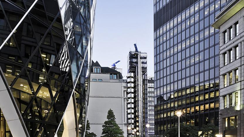 Exterior view of modern office buildings in London with Lloyd's in the distance