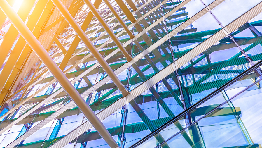 close up of building with sunlight shining through the glass